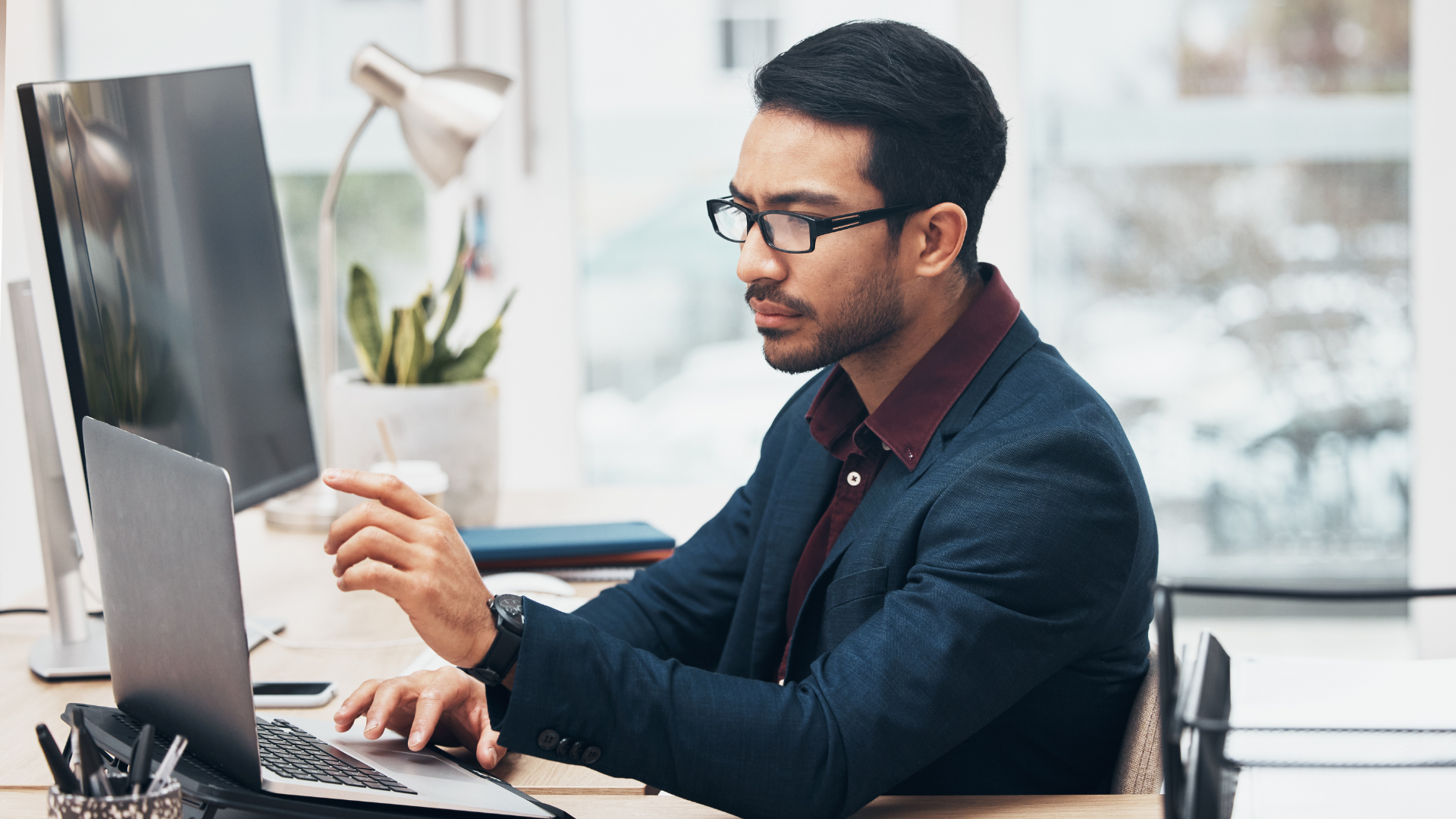 A business owner inputting data into QuickBooks Online